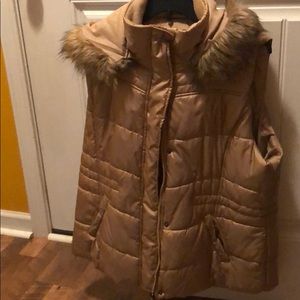 Puffer vest with detachable hood.